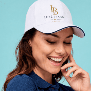 Woman wearing a custom printed white cap with luxury logo, personalised cap printing in London