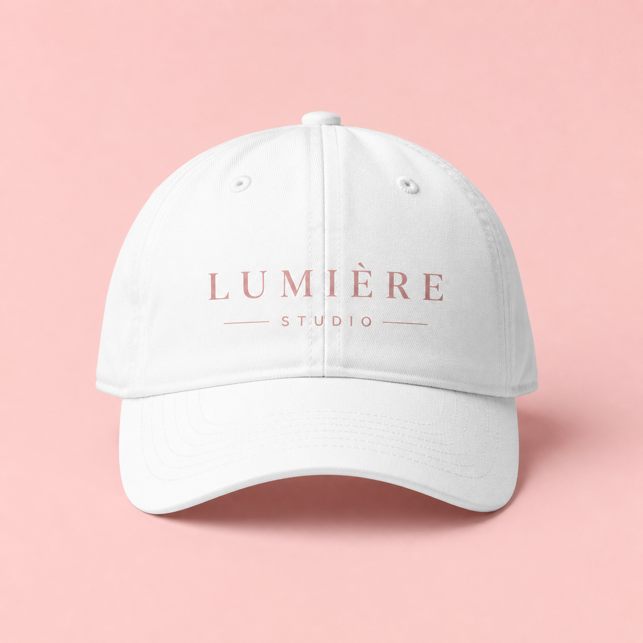 Custom printed white cap with logo on pastel background by LBG Print Shop London